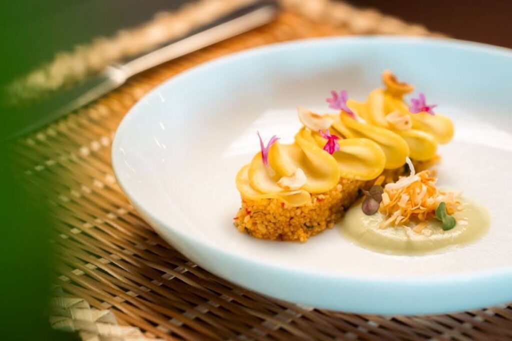 An entree on a white plate and a placemat at Zing Zing, Secret Bay Dominica